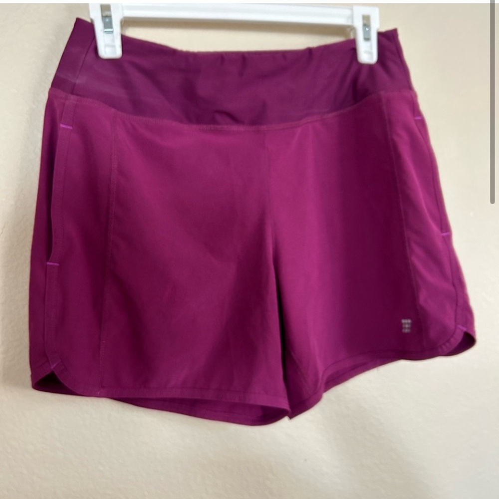 Title Nine purple activewear shorts with pockets and adjustable waist
Size: S